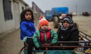 Syrian refugee children arrive at the Bab al-Salameh border crossing into Turkey near the embattled northern city of Aleppo.