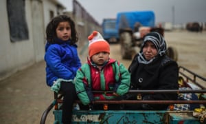 Refugee children arrive in a cart in Bab-Al Salam, near Azaz, northern Syria.