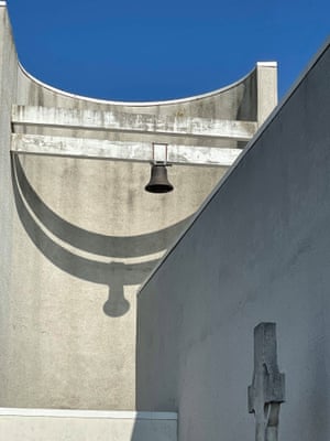 A close up detail of a blocky church bell tower