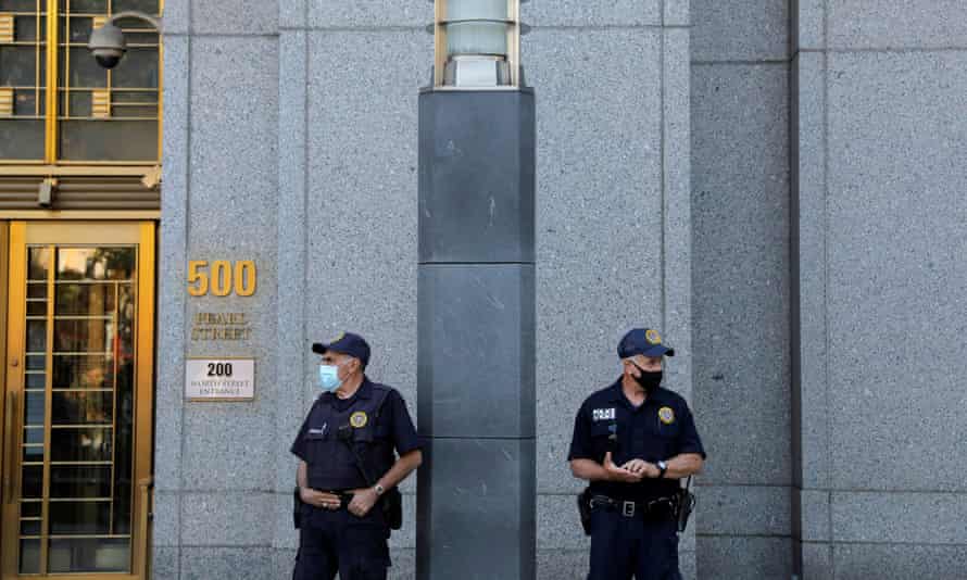 Guards wearing face masks stand outside Manhattan federal court in August. Abdullah was due to be presented before a magistrate in Manhattan on Wednesday.