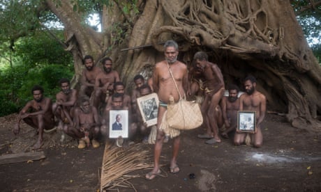 Jack Malia and villagers with photos of Prince Philip