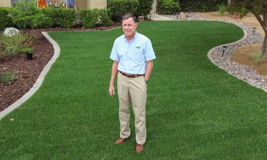 Norm Lopez, a sales rep for Southland Sod Farms, on the lawn of one of his clients.