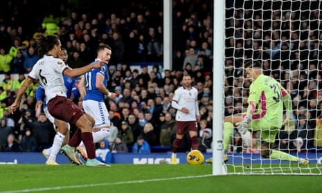 Jack Harrison of Everton scores the opening goal against Manchester City.
