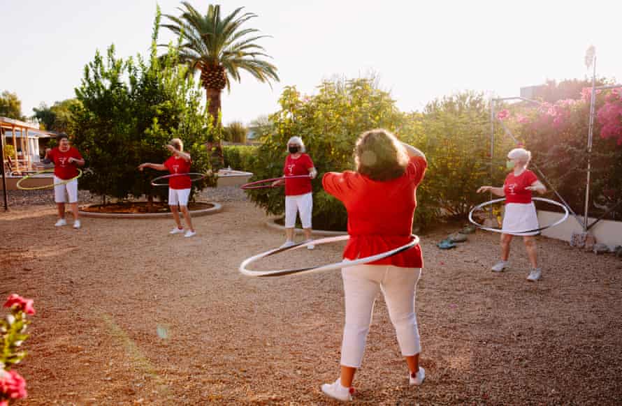 Members of the Sun City Poms cheerleaders practise hula hooping in one of their backyards in the midst of pandemic restrictions.
