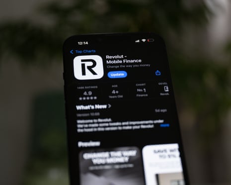 A smartphone screen displays the Revolut app page with an update button, against a blurred leafy background