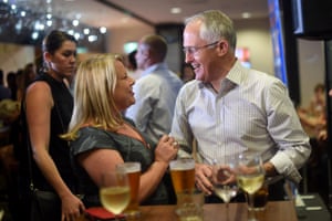 Turnbull has a beer with Liberal member for Solomon Natasha Griggs at a politics in the pub event in Darwin