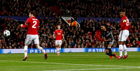 Vitinho slides in to score at Old Trafford.
