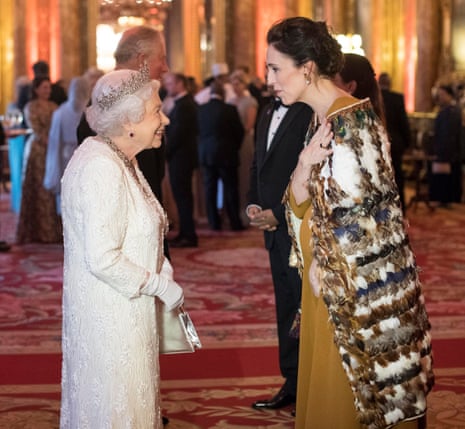 The Queen and Jacinda Ardern smiling and talking at a function