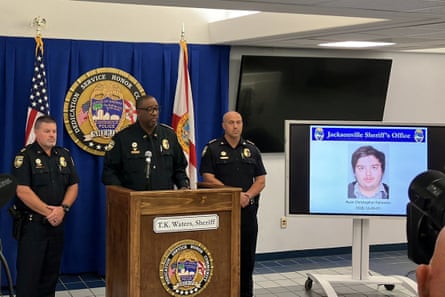 The photograph of Ryan Christopher Palmeter, 21, is shown at a news conference after being identified by Sheriff TK Waters as the white man who killed three Black people before shooting himself at a Dollar General store on Saturday.