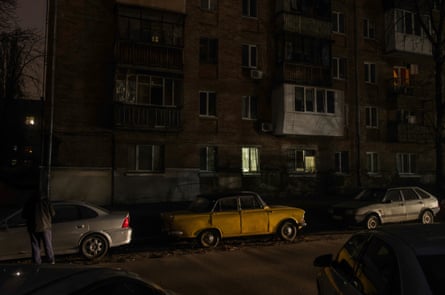 A dark street and residential buildings