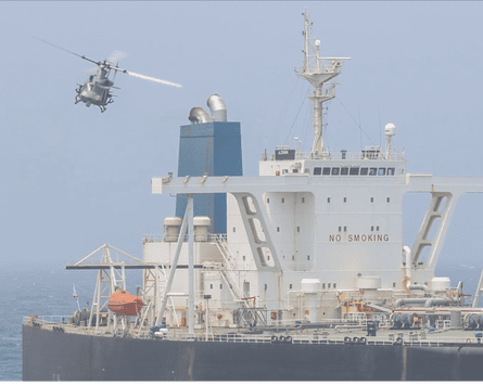 A helicopter landing on a tanker
