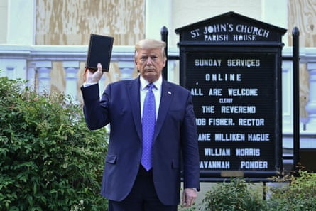 Donald Trump holds up a Bible outside St John’s, across Lafayette Square from the White House in June.