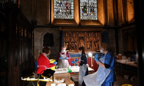 Clinicians and volunteers prepare doses of the Pfizer-BioNTech Covid-19 vaccine today in the Chapel of Saint Michael the Archangel inside Salisbury Cathedral.