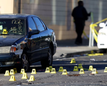 A shooting segment pinch forensic grounds markers surrounding a car