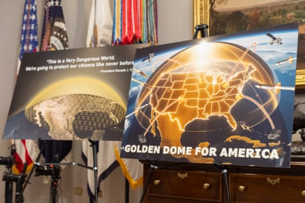 two posters on stands promoting golden dome