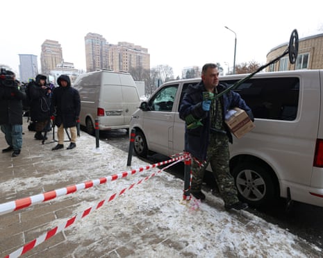 An investigator works outside a residential building where the assassination attempt on Russian Lt Gen Vladimir Alexeyev took place in Moscow, Russia.