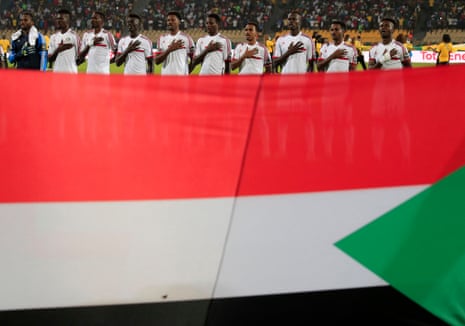 Sudan players sing their national anthem.