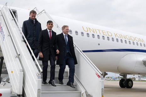 Rishi Sunak getting off his plane after arriving at Warsaw Chopin airport, accompanied by Jeremy Hunt, the chancellor (left), and Grant Shapps, the defence secretary (right).