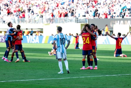 Lionel Messi looks connected arsenic Spain celebrate