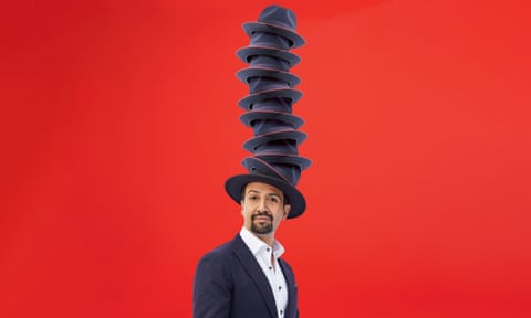 Portrait of Lin-Manuel Miranda with many hats on his head