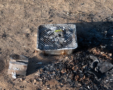 The remains of a disposable barbeque left by reckless people next to the Jubilee River in Dorney, Buckinghamshire.