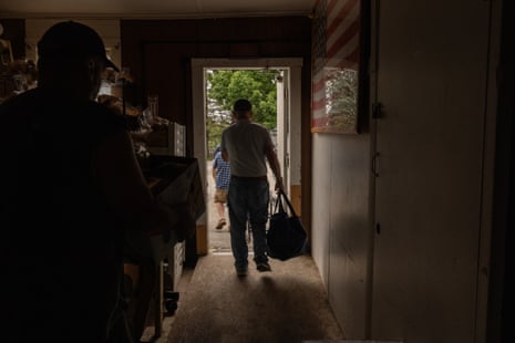 Patrons exit the No Greater Love food pantry