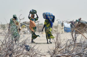 Women arrive in a camp in the village of Kidjendi after fleeing from Boko Haram attacks.