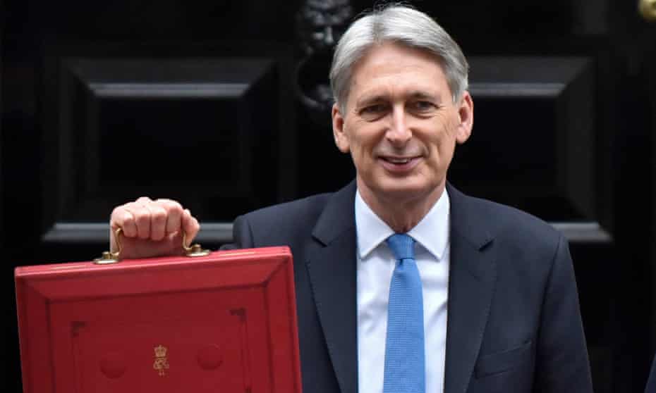 Philip Hammond holds the budget box as he leaves Downing Street.