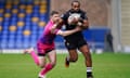Huddersfield Giants' Adam Clune (left) and London Broncos' Iliess Macani in action during the Super League match at the Cherry Red Records Stadium.
