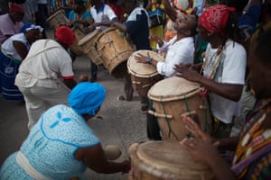 Garifuna people, seen here playing drums and maracas