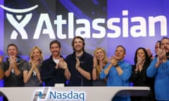 Co-founders of Atlassian, Mike Cannon-Brookes, centre, and Scott Farquhar, third from left, enjoy the reaction to the company’s initial public offering on Thursday, which raised US$462m.