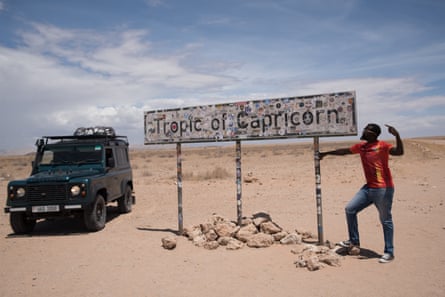 Echwalu strikes a pose at the tropic of capricorn on the way from Namibia to South Africa