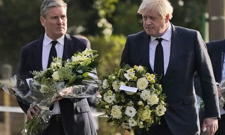 Labour’s Keir Starmer (left) and the prime minister, Boris Johnson, take flowers to the church in Leigh-on-Sea