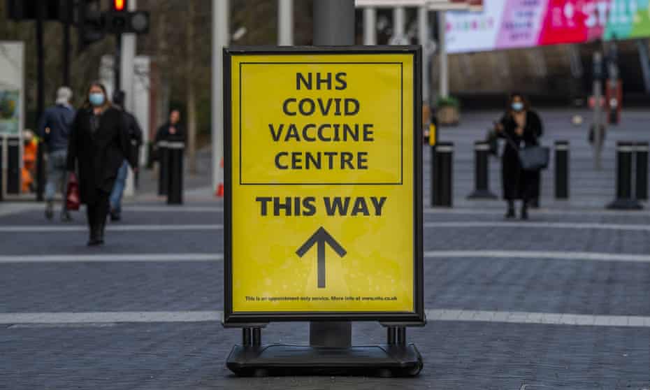 A sign near Wembley stadium reads 'NHS Covid vaccine centre this way'