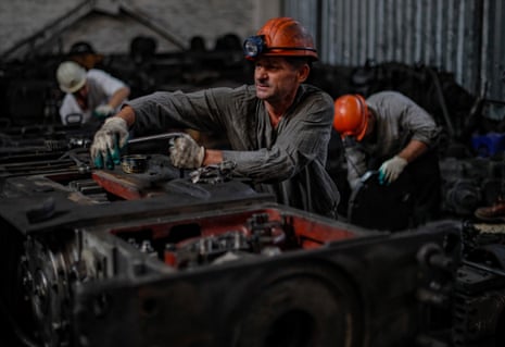 Miners preparing a coal-plow machine in Dolzhansk, occupied Luhansk.