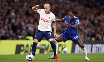 Richarlison of Tottenham Hotspur controls the ball whilst under pressure from Trevoh Chalobah.