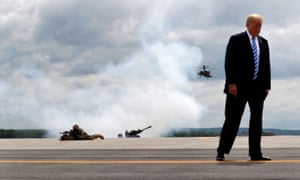 Trump observes a demonstration with the US army’s 10th Mountain Division troops, an attack helicopter and artillery, as he visits Fort Drum, New York, in August 2018.