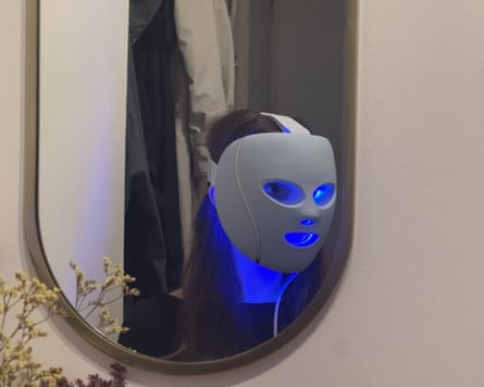 The writer in a mirror wearing the Shark Cryoglow mask with blue light glowing underneath.