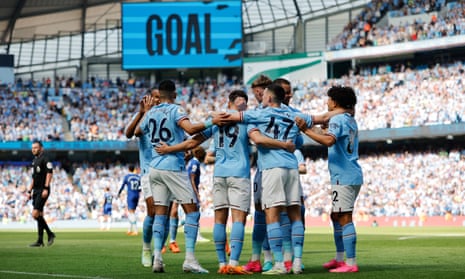 Julian Alvarez celebrates scoring for City with teammates.