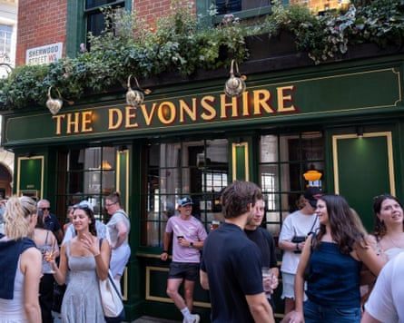 Customers standing outside the Devonshire pub