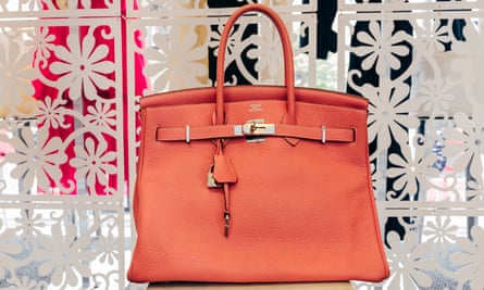 “A bag will fit everybody. There is no size for woman for handbags. They have a great resale value,” said Elizabeth Murphy, owner of Eleven consignment stores. Shown: Hermes Birkin bag for sale at Michael’s