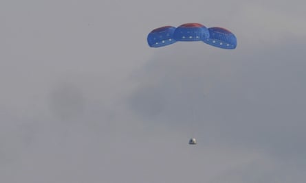 Blue Origin’s New Shepard capsule parachutes safely down to the launch area, near Van Horn, Texas, on Tuesday.