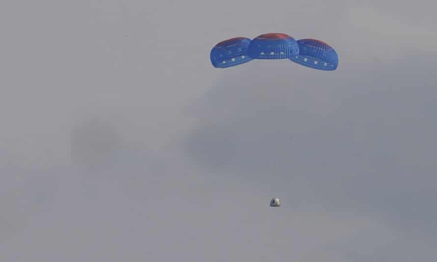 Blue Origin’s New Shepard capsule parachutes safely down to the launch area, near Van Horn, Texas, on Tuesday.