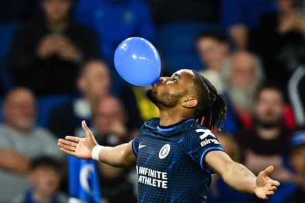 15 May 2024 Chelsea’s Christopher Nkunku celebrates with a balloon after scoring his team’s second goal against Brighton at the Amex Stadium. Chelsea won 2-1.