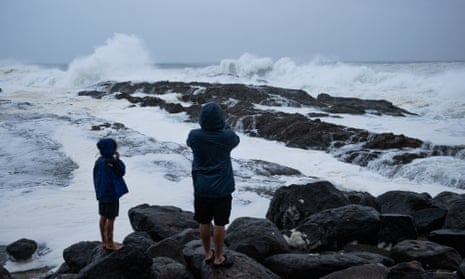 Children watch the waves.