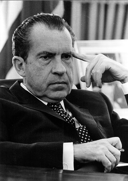 photo of nixon with finger against temple
