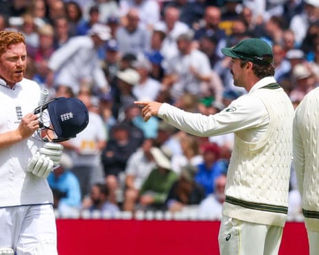 Jonny Bairstow of England (left) talks to the Australia players while waiting for a stumping decision after the batter thought the over was complete and was stumped by Alex Carey of Australia