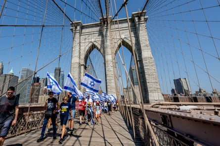 Protesters against the Israeli judicial overhaul march across the Brooklyn Bridge on 23 July 2023 in New York City.