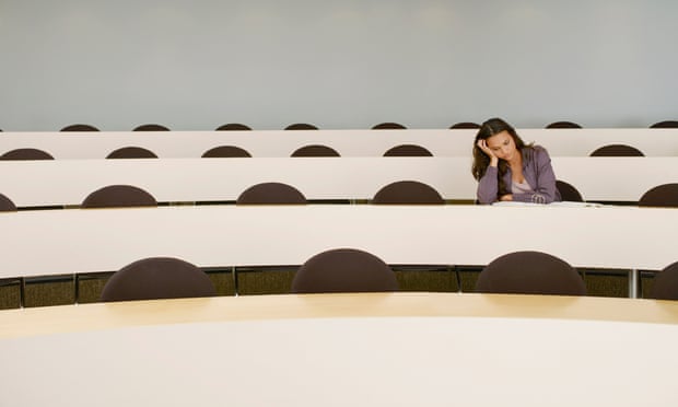 woman alone in lecture hall