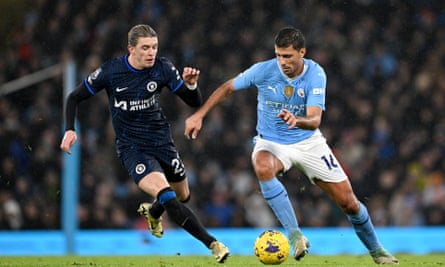 Conor Gallagher attempts to intercept the ball from Rodri